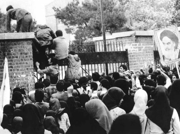 Iranians scale the wall of the U.S. embassy in Tehran in 1979