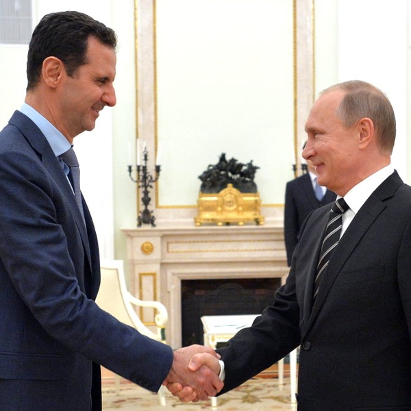 Bashar al-Assad greets Vladimir Putin in Moscow