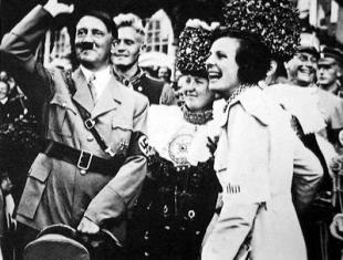 Leni Riefenstahl, right, celebrates the debut of Triumph of the Will with Adolf Hitler
