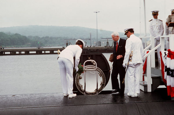 Hyman Rickover, center, enters a nuclear submarine named after him