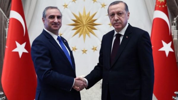 Israel's new ambassador to Turkey, Eitan Naeh, shakes hands with Turkish President Recep Tayyip Erdogan